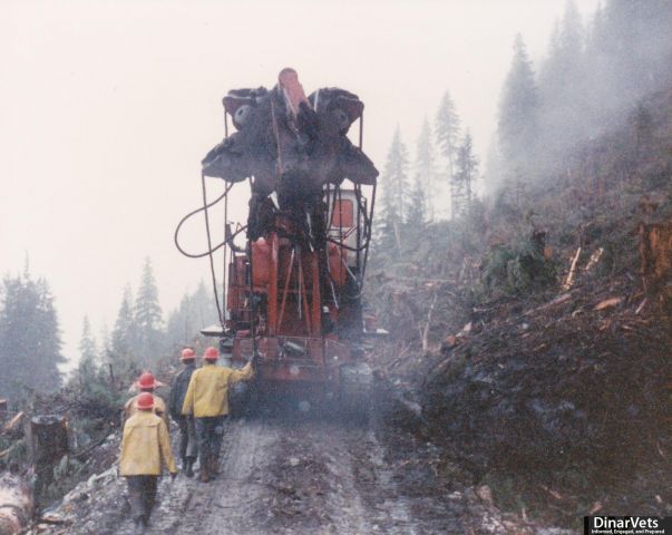 009 Madill yarder backing up the road