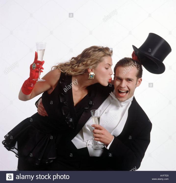 very-chic-dressed-couple-having-fun-at-a-party-while-drinking-champagne-A1F7D3.jpg